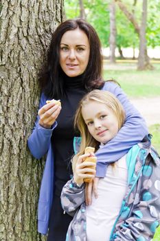 Photo of mother and daughter are eating