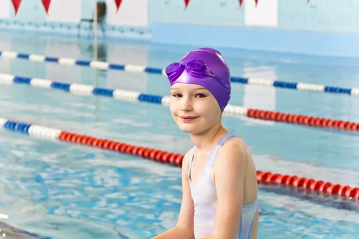 Photo of cute girl in swimming pool