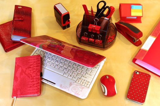 Stationery and business accessories in red color scheme