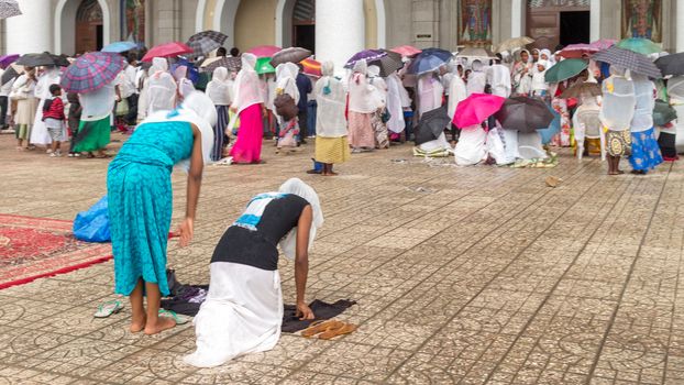 Addis Ababa: April 10: Devoted Ethiopian Orthodox followers bow down hundreds of times to worship God, and remember the pain and suffering of Jesus Christ, during Siklet (crucifixion) on April 10 ,2015 in Addis Ababa, Ethiopia