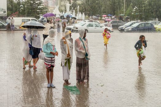 Addis Ababa: April 10: Devoted Ethiopian Orthodox followers stand undeterred by the pouring rain to observe Siklet, the crucifixion of Jesus Christ, at Bole Medhane Alem Church on April 10 ,2015 in Addis Ababa, Ethiopia