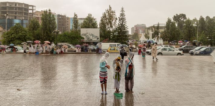 Addis Ababa: April 10: Devoted Ethiopian Orthodox followers stand undeterred by the pouring rain to observe Siklet, the crucifixion of Jesus Christ, at Bole Medhane Alem Church on April 10 ,2015 in Addis Ababa, Ethiopia