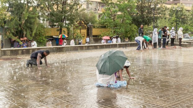 Addis Ababa: April 10: Devoted Ethiopian Orthodox followers bow down hundreds of times to worship God, and remember the pain and suffering of Jesus Christ, during Siklet (crucifixion) on April 10 ,2015 in Addis Ababa, Ethiopia