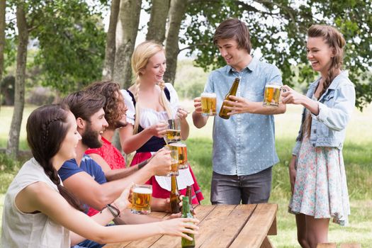 Group of friends celebrating oktoberfest on a sunny day