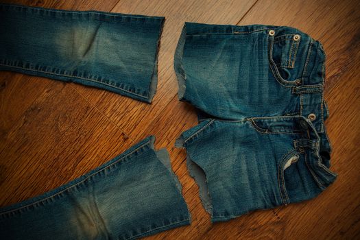 cut old jeans on wooden boards, instagram image style