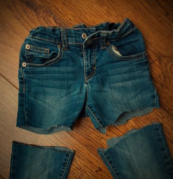 cut old jeans on wooden boards, instagram image style