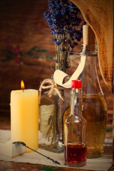 Vintage still life with pharmacy vials, dried calendula and a candle in an old drugstore, instagram image style