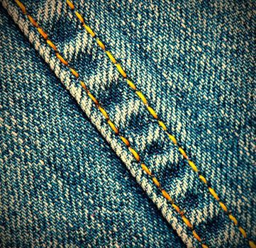 old jeans background with diagonal seams