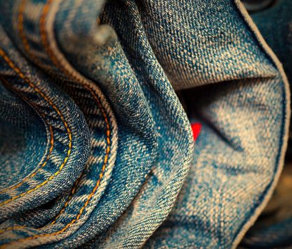 stitching on blue jeans, close-up. Shallow depth of field. instagram image retro style
