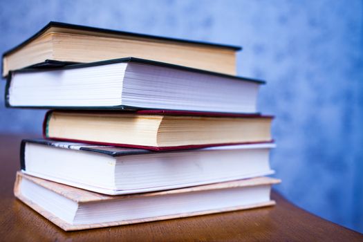 stack of book on the wooden table