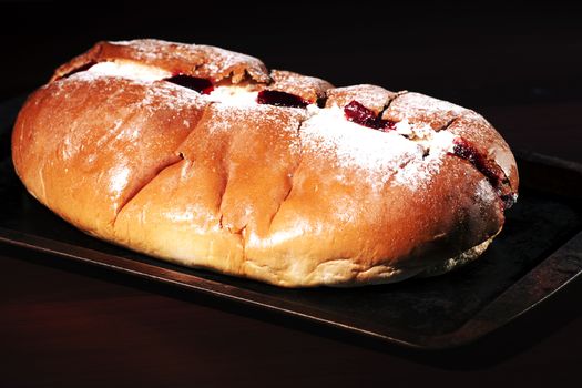 Raspberry jam and cream pastry on a baking tray