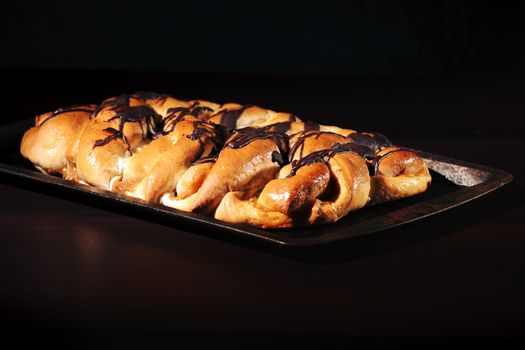 Chocolate and caramel danish pastry on a baking tray