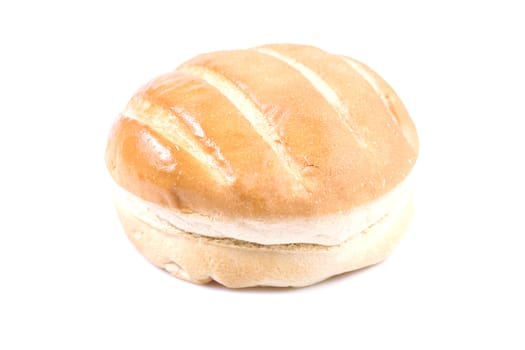 Round loaf of bread on a white background