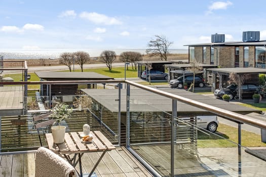 Bright balcony with furniture in a modern danish home