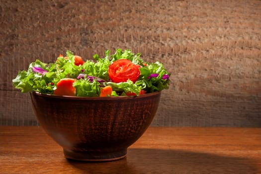 Fresh green  organic salade on wooden background