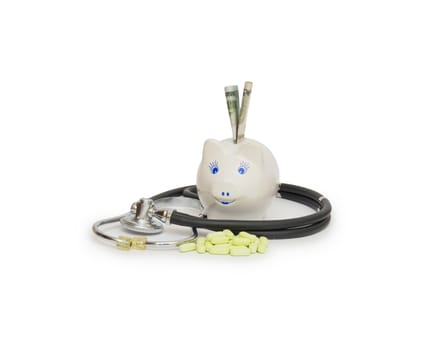 piggy bank with stethoscope isolated on white