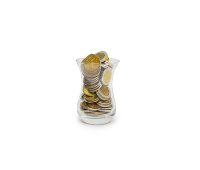 coins in glass isolated on the white background