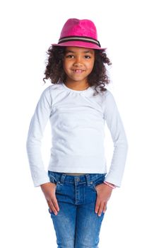 Portrait of a pretty mulatto girl in pink hat smiling at camera on white background
