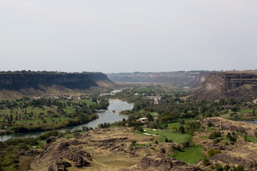 Scenic landscape view of the Snake River Canyon near Twin Falls, Idaho showing farms established through irrigation on the river banks in the valley running through the gorge