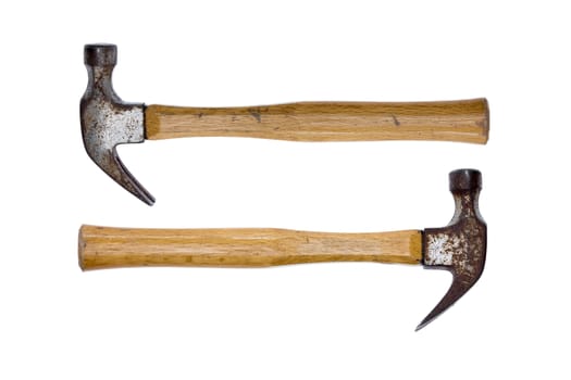 Two old rusty claw hammers arranged facing in opposite directions conceptual of equal power isolated on a white background