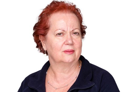 Perplexed senior lady with a puzzled frown staring intently at the camera with an unconvinced expression, isolated on white