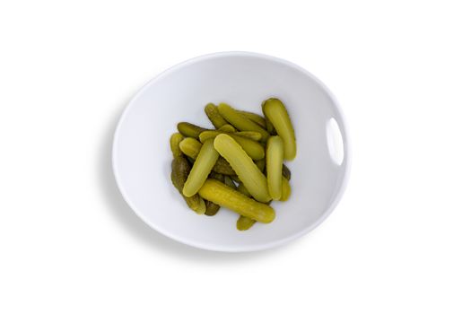 Close up Pickles for Your Taste Buds on a Contemporary Glossy Bowl Isolated on a White Background. Captured in High Angle View.