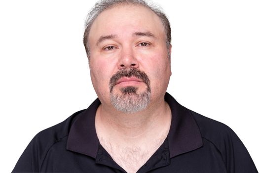 Sombre looking middle-aged man staring at the camera with a thoughtful expression, isolated on white