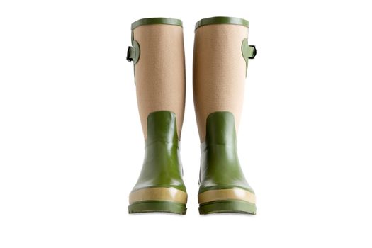 Pair of stylish ladies gardening boots, gumboots or wellington boots made of green and beige waterproof rubber, isolated on white