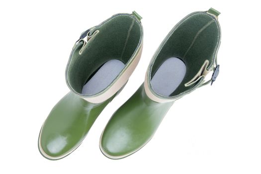 Overhead view looking inside a pair of green garden boots down to the inner sole standing side by side isolated on white background