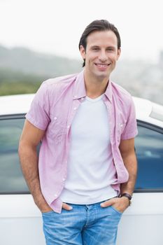 Man leaning on the door of his car