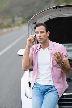 Man after a car breakdown at the side of the road