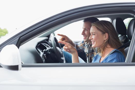 Couple on a road trip in their car