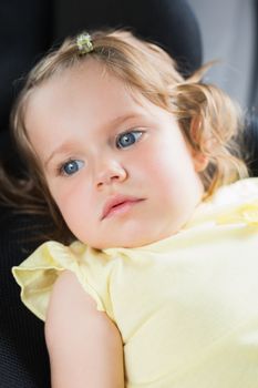 Pretty little girl in a car 