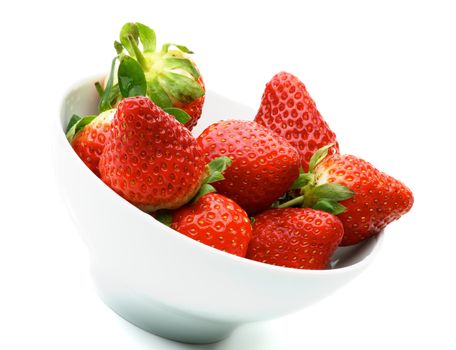 Heap of Perfect Ripe Strawberries in White Bowl isolated on white background