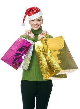 blonde smiling woman with christmas hat holding gift bags