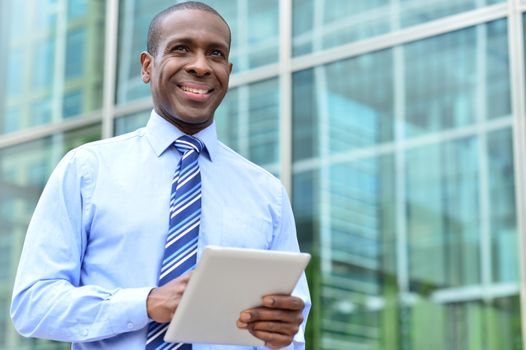 Male executive with digital tablet at outdoors