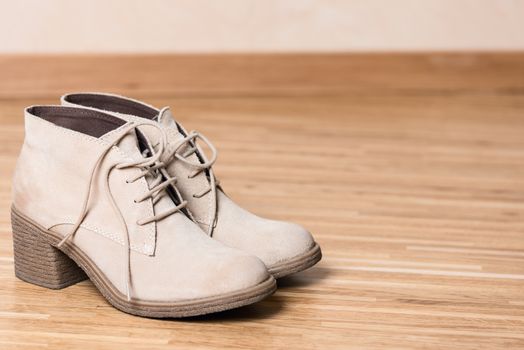 Grey women shoes on wooden floor