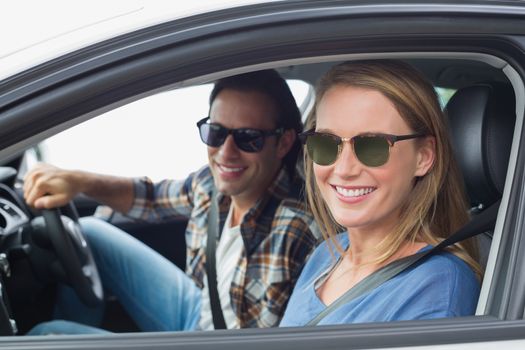 Couple on a road trip in their car