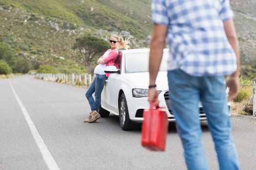 Couple after a car breakdown at the side of the road