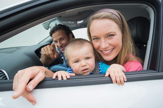 Parents and baby on a drive in their car