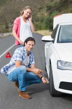 Couple after a car breakdown at the side of the road