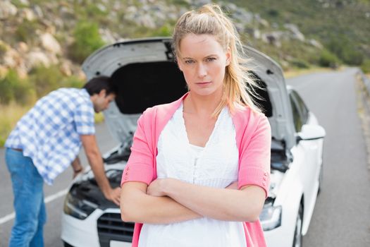 Couple after a car breakdown at the side of the road