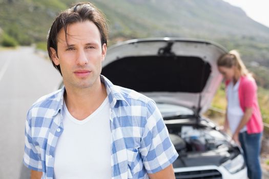 Couple after a car breakdown at the side of the road