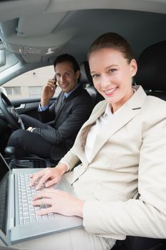 Business team working together in the car