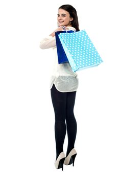 Full length shot of young girl with shopping bags