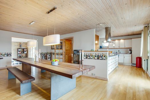 Large table in a Danish dining room and kitchen