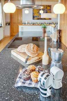 Cake bread and coffee on a granite kitchen worktop