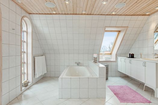 luxury tiled white bathroom in a traditional Danish home