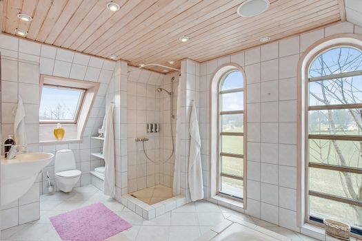 luxury tiled white bathroom in a traditional Danish home