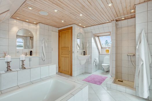 luxury tiled white bathroom in a traditional Danish home